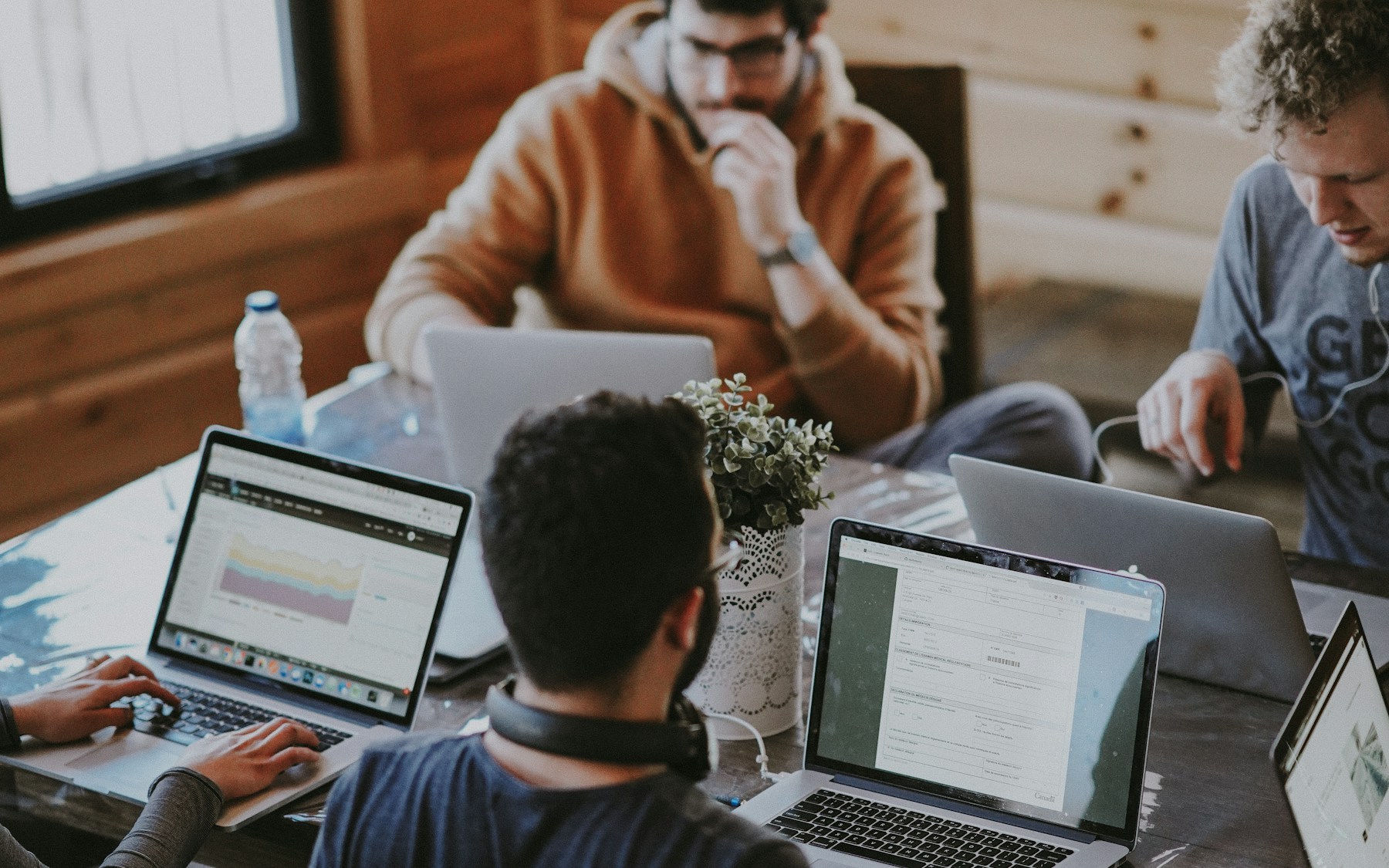 Business team collaborating around a table in a bright office