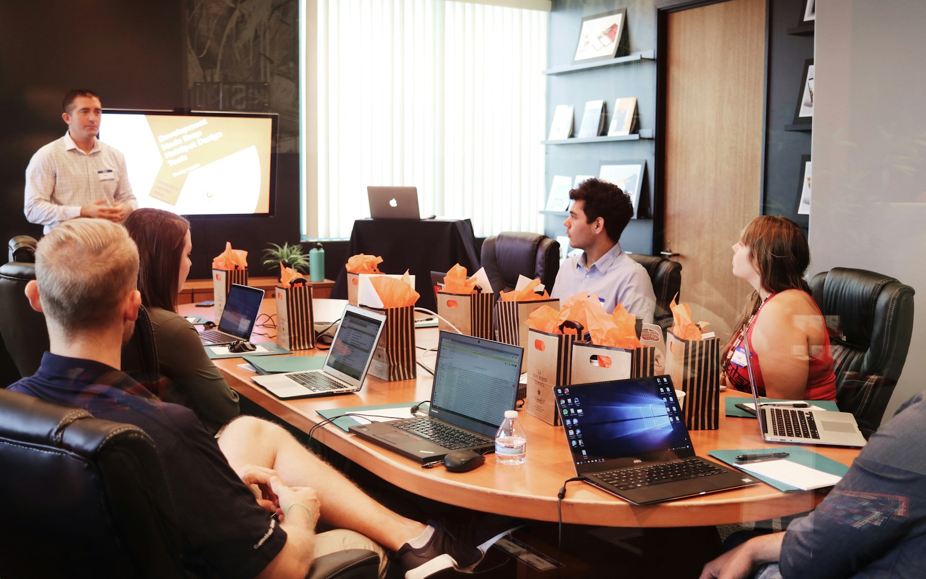 Team around a conference table during a project kickoff presentation